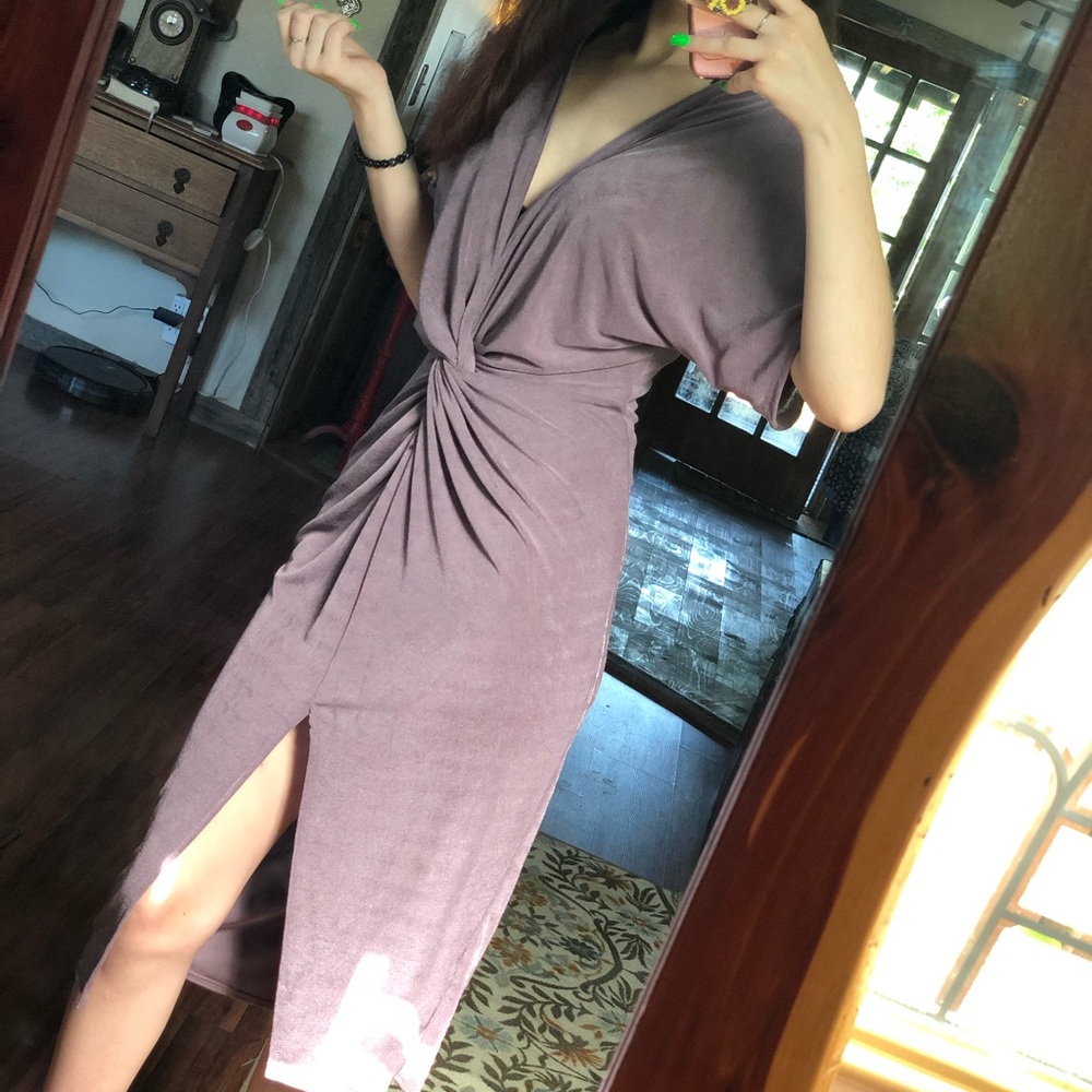 Purple shimmery tight formal dress with a slit